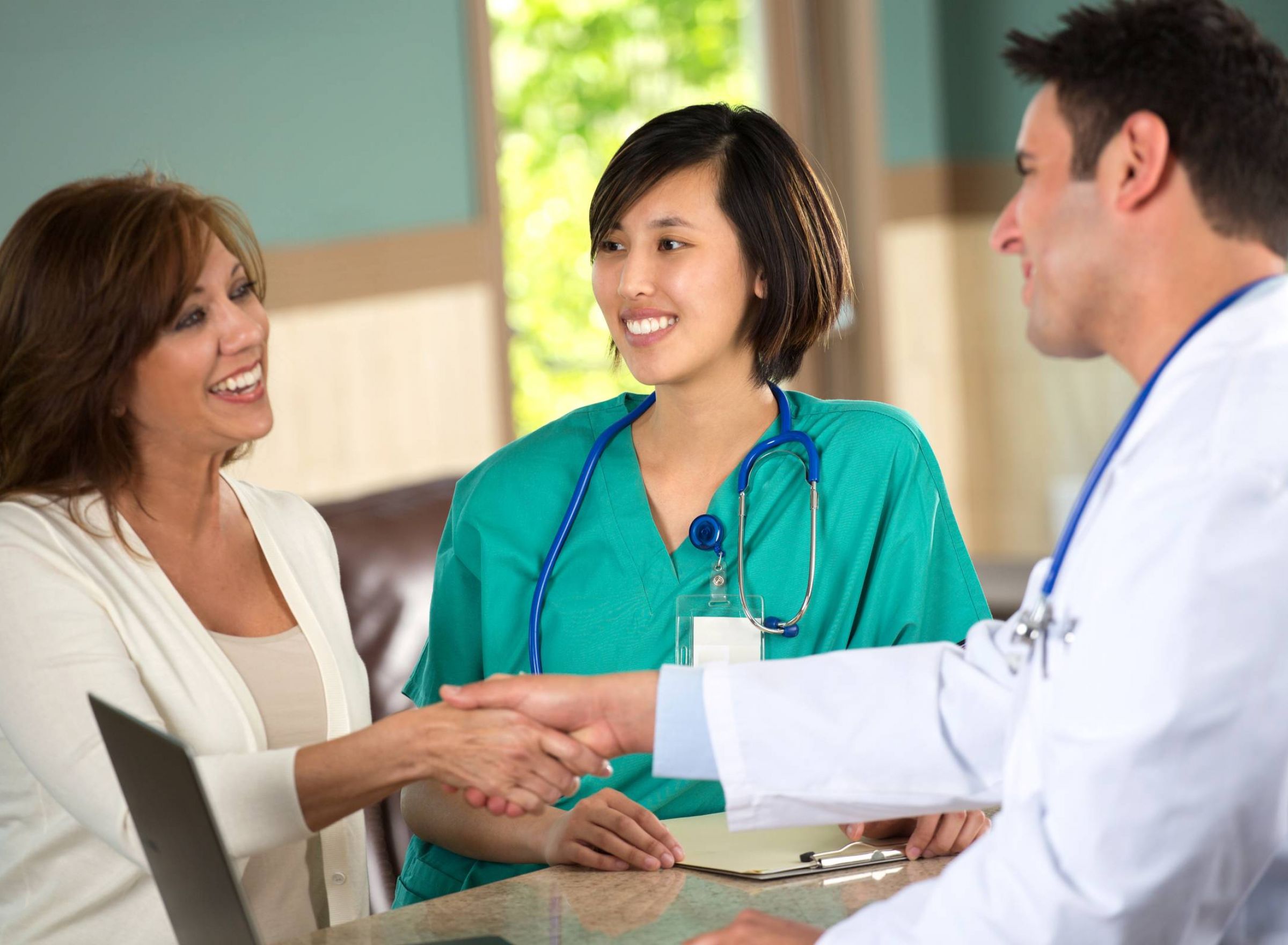 The Delta Pearland luxury apartment in Pearland, TX with medical and healthcare staff talking with a patient in the healthcare facility and clinic