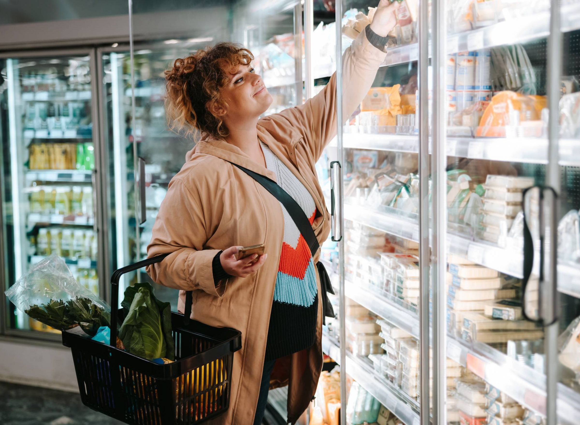 The Delta Pearland luxury apartment in Pearland, TX with a woman shopping for groceries in supermarket